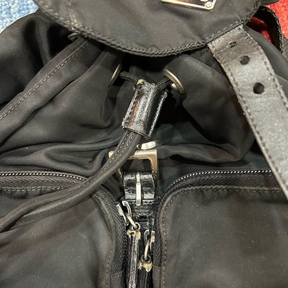 Prada nylon backpack authentic in good condition. Tears on the front straps. main image 8